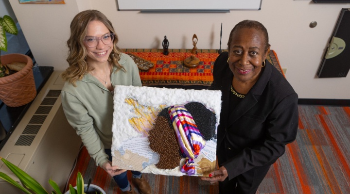 Samantha Nyweide and Lillian Williams holding the “Sojourner Truth” art piece. 