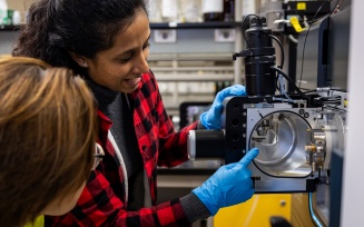 Diana Aga and her PhD student Mindula Wijayahena in a research lab.