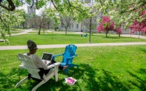 Student on a laptop outside. 