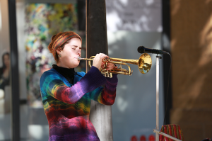 Image of student playing trumpet in recital. 