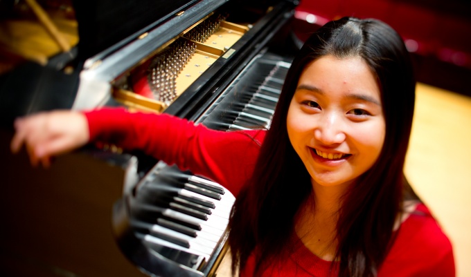 Music Student Tingfei Li in Slee Hall on North Campus. 