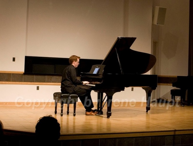 A Performance Institute member playing the piano. 
