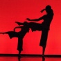 2 dancers' silhouettes. 