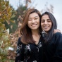 Students Pemba Sherpa (left) and Hemanta Adhikari stand together outdoors, smiling, on North Campus. 