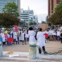 Two UB medical students speaking to a BLM crowd in Niagara Square during the White Coats 4 Black Lives protest. 