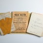 Old records from the Michigan Avenue Y.M.C.A. in Buffalo include items such as an East Side Business Professional and Trade Directory, a flyer for a public meeting with political candidates, and a luncheon club agenda. 