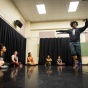 Chanon Judson performs in front of a class. 