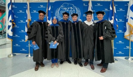 Graduating Master and PhD students after the ceremony in the Center for the Arts. 