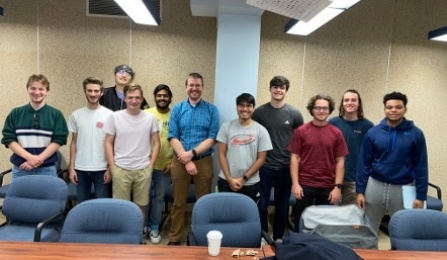A group photo of with UB students and Dr. Alexander Kitt. 