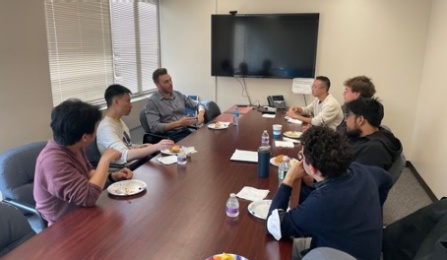 Prof. Luke Lyle at a lunch meeting with physics graduate students during his visit at UB. 