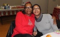 Zoom image: Rachel Bolden and her daughter LaMica S. Strong at the holiday party. 