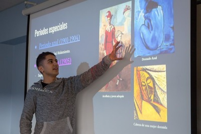 Student explains painting in Age of Lorca class, spring 2018. 