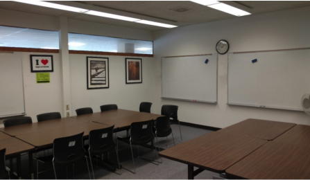 Student area with tables and white boards. 