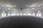 The fourth-floor auditorium has been renovated into a 110-seat signature space featuring arched windows and a restored curvilinear ceiling. Photo: Douglas Levere