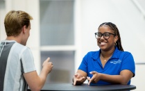 students smiling and talking. 