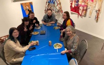 2023 UB Art Scholarship Reception in Lower Gallery, 5 Graduate Student Morrison Award Recipients seated around a table with Adjunct Professor. 