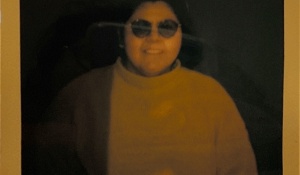 Zoom image: Yellowed polaroid headshot of Maria Barrientos