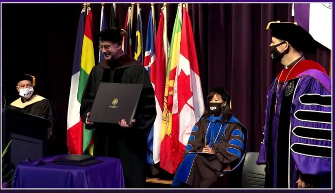 Gerald Mead being awarded an Honorary Doctor of Fine Arts degree. 