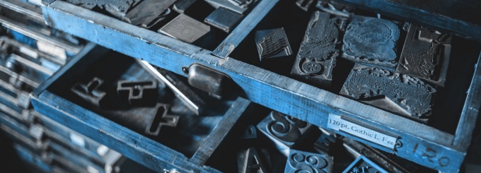 drawers filled with letter-press dies. 