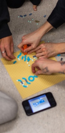 Lego pieces serve as a letter press for students in Kelly Myers-Chunco’s Art 321 class. The class was divided into groups and each group used the Lego pieces to develop a new typeface for their final projects. Photos: Douglas Levere.