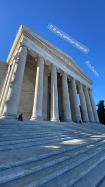 Exterior photo of theThomas Jefferson memorial, with a clear blue sky above. 
