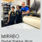 Three people wearing aprons stand in front of a printing press. "MIRABO Rachel Shelton, Mizin Shin, Bob Fleming". 