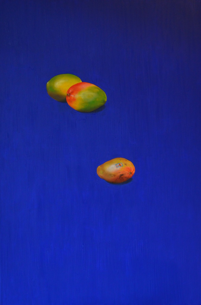 painting of three mangoes on a deep blue background. 