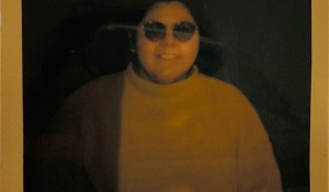 Zoom image: Yellowed polaroid headshot of Maria Barrientos