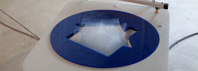 machine that makes house shaped "clouds" out of helium bubbles. 