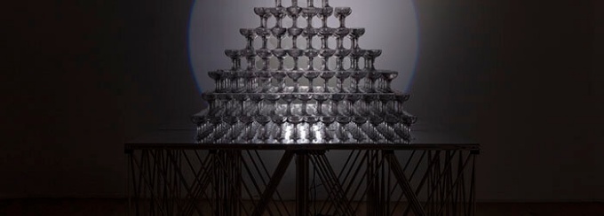 Image of a pyramid stack of champaign glasses. 