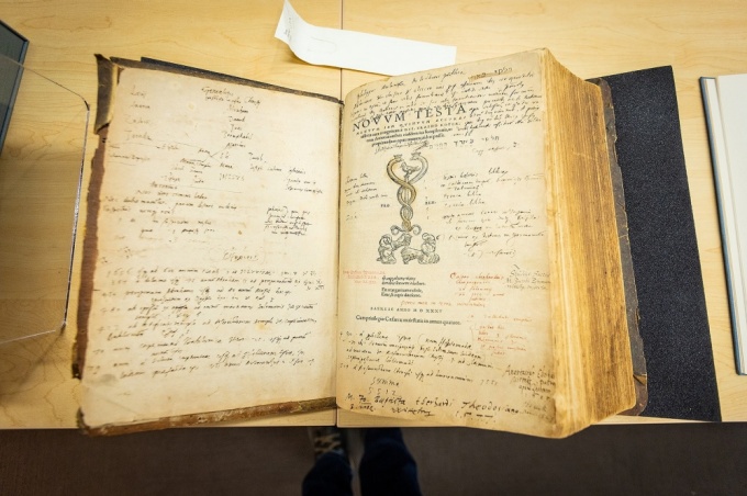“Erasmus’ New Testament” is one of the rare books examined by students in Kelly Myers-Chunco’s class. The hand-written notes in the margins are from previous owners and are always a source of fascination for all ages, according to Myers-Chunco. Photo: Douglas Levere. 