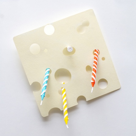 Zoom image: Small Sculpture on Screw: Birthday candles in cheese, 2024, Acrylic paint and paper 