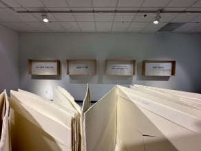 Zoom image: Foreground: K. MacNeil artist book &quot;this is not a love song&quot;; Background: K. MacNeil shadow boxes &quot;Witness My Shame&quot;. 
