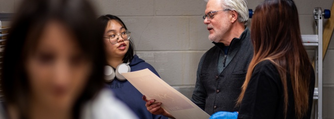 Zoom image: Print Media Technician Jeff Sherven in discussion with students in the relief and letterpress studios. 