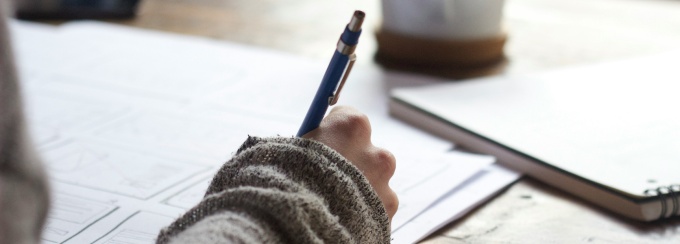 A person writing. 