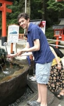 Student Russell Guilbault standing next to a fountain in Tokyo. 