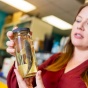 Corey Krabbenhoft holds a fish sample inside her lab at UB. Her research found that fish diversity in arid regions of the U.S. and Australia dropped amid reduced water availability over the past four decades. Photo: Douglas Levere. 