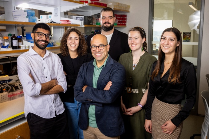 The lab of Omer Gokcumen (front center) co-led the study and helped analyze the genomes of 68 ancient humans for answers about our ability to begin breaking down starch in the mouth. Photo: Meredith Forrest Kulwicki. 