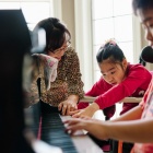 Expressing interest: Biologist Soo-Kyung Lee with her daughter Yuna and her son Joon. Yuna cannot walk or speak, but she likes stuffed animals and toys that light up or play music. Photograph by Eric Tronolone. 