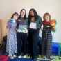 UB SLP Students featured left to right: Marissa Belmonte, Annie Jarvis, Drishti Chudasama, and Moira Griffin posing with hand puppets, children&rsquo;s book, and therapy timer at Buffalo Promise Neighborhood Children&rsquo;s Academy. 