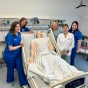 Faculty assisting in simulation experience. 
