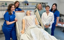 Faculty assisting in simulation experience.