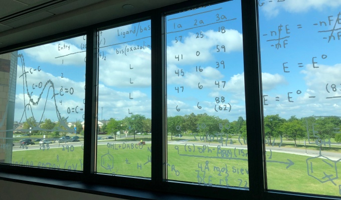 Chemistry formula graphics placed on windows housed in the Department of Chemistry's Fronczak Hall . 