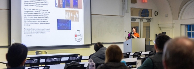 Speaker presenting in University at Buffalo lecture hall. 