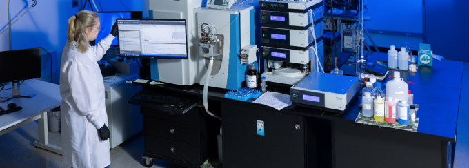 Student standing in the UB Chemistry Instrument Center. 