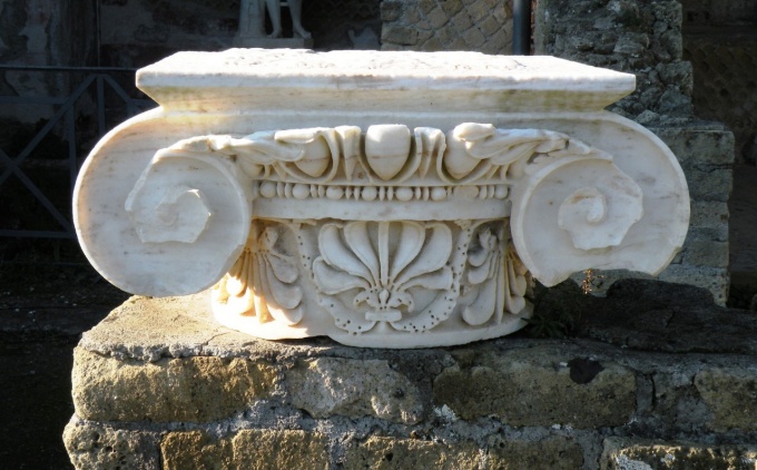 A piece of carved stonework from a former pillar. 