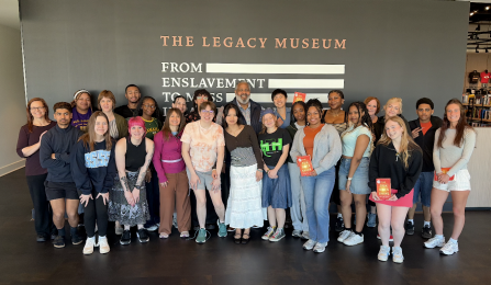 Group of students and faculty outside the Legacy Museum store. 