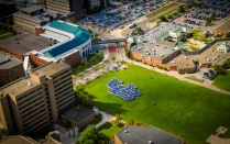 Aerial view of students forming interlocking UB. 