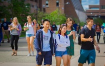 students walking through Founder's Plaza. 