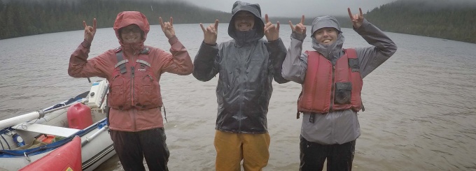 Professor Elizabeth Thomas and Geology graduate students Caleb Walcott and Karlee Prince (left to right) with horns up. 